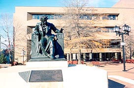 [photo, Edgar Allan Poe statue (1921), by Moses Jacob Ezekiel, John and Frances Angelos Law Center, University of Baltimore, Gordon Plaza, 1429 Maryland Ave., Baltimore, Maryland]